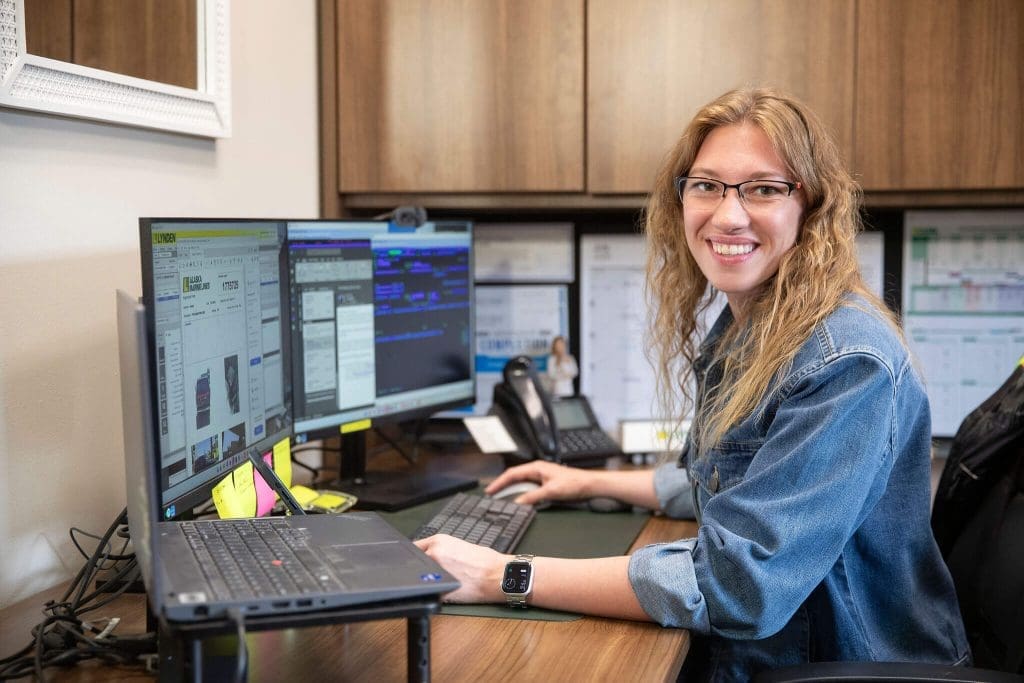 Alaska Marine Trucking employee working at her desk