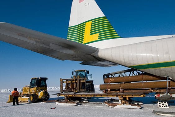 Loading oversized equipment into Hercules aircraft.