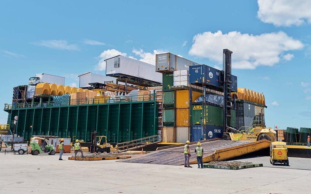 Construction supplies and building materials being loaded onto the barge to ship to Hawaii.