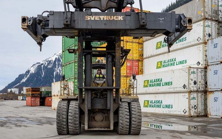 Employees safely moving equipment